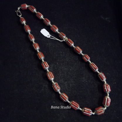 Silver coral beads.