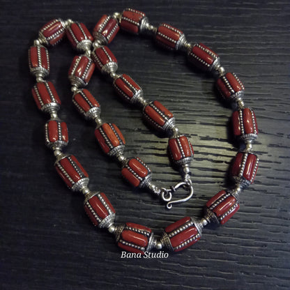 Silver coral beads.